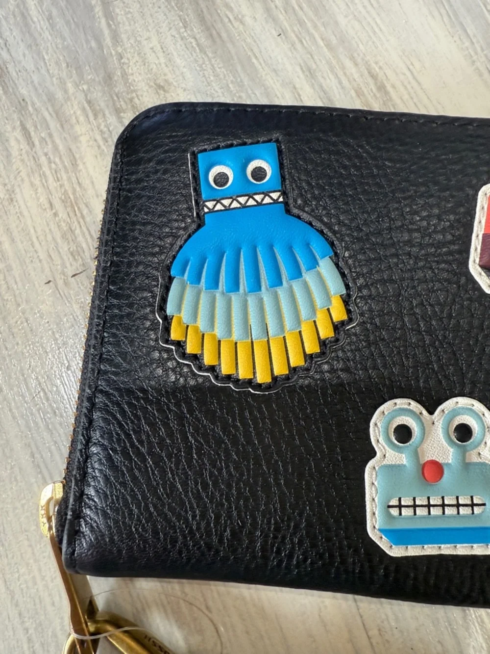Rare Fossil Emma Black Zip-Around Wristlet with Colorful Robot Appliqués